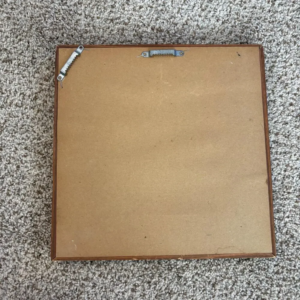 Vintage-style, square wall mirror features a thick, beveled solid wood frame